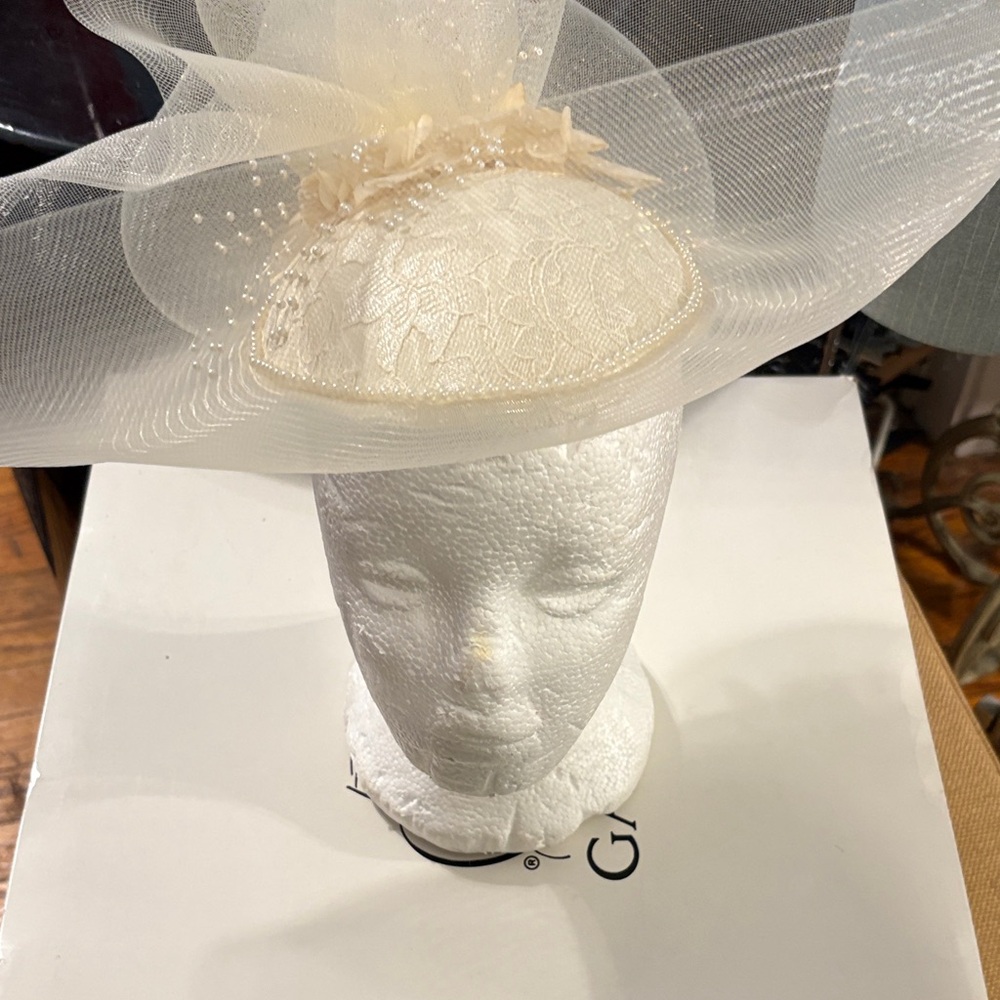 Elegant Cream Fascinator with Floral Accents